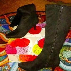 Never worn brand new knee high suede black boots. Maybe 1 inch heel. NIB